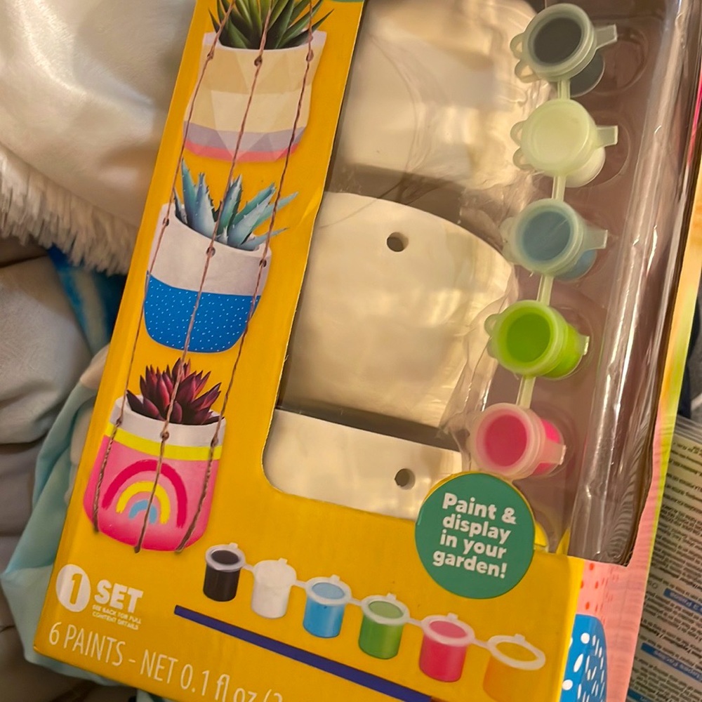 three plant holders that you can paint with paints too sorry my picture was bad